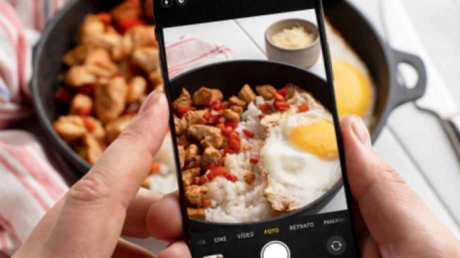 mobile phone taking photo of food